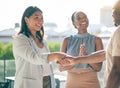 Business people, handshake and applause in collaboration, deal or agreement in city. Shaking hands, happy and group Royalty Free Stock Photo