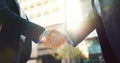 Business people, handshake and city for partnership, agreement or greeting in outdoor deal or meeting. Closeup of Royalty Free Stock Photo