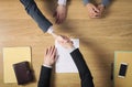 Business people handshaking after signing an agreement