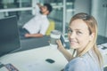 Business people having brake after job. Woman looking at camera. Royalty Free Stock Photo