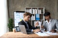 Business people having consultation about wind energy at company office. Business team discussing about windmill and Royalty Free Stock Photo