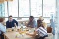 Business people having lunch at office cafeteria Royalty Free Stock Photo