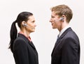 Business people in headsets standing face to face Royalty Free Stock Photo