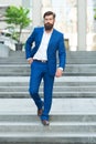 Business people. On his way to success. Walking down street. Mature hipster with beard on stairs. Bearded man in