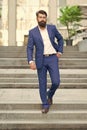 Business people. On his way to success. Walking down street. Mature hipster with beard on stairs. Bearded man in