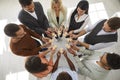 Business people hold puzzle pieces as sign of team building, company merger or joint venture. Royalty Free Stock Photo