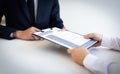 Business people hold resume documents, interviews for the work experience of young men applying as financial accountants for the c Royalty Free Stock Photo