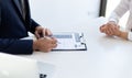 Business people hold resume documents, interviews for the work experience of young men applying as financial accountants for the c Royalty Free Stock Photo