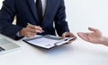 Business people hold resume documents, interviews for the work experience of young men applying as financial accountants for the c Royalty Free Stock Photo