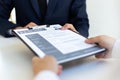 Business people hold resume documents, interviews for the work experience of young men applying as financial accountants for the c Royalty Free Stock Photo