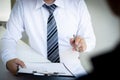 Business people hold resume documents, interviews for the work experience of young men applying as financial accountants for the c Royalty Free Stock Photo