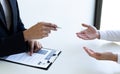 Business people hold resume documents, interviews for the work experience of young men applying as financial accountants for the c Royalty Free Stock Photo