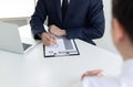 Business people hold resume documents, interviews for the work experience of young men applying as financial accountants for the c Royalty Free Stock Photo