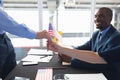 Business people holding an American flag at conference registration table Royalty Free Stock Photo