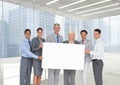 Business people holding blank card in office Royalty Free Stock Photo