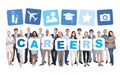 Business People Holding Word Careers and Related Symbols Royalty Free Stock Photo