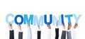 Business People Holding the Word Community Royalty Free Stock Photo