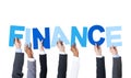 Business People Holding the Word Finance Royalty Free Stock Photo