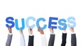 Business People Holding the Word Success Royalty Free Stock Photo
