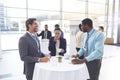 Business people interacting with each other at table during a seminar Royalty Free Stock Photo