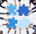 Business People and Jigsaw Puzzle Pieces Royalty Free Stock Photo
