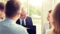 Business people with laptop meeting in office Royalty Free Stock Photo