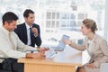 Business people laughing with interviewee Royalty Free Stock Photo