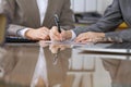 Business people or lawyers signing contract at meeting. Close-up of human hands at work Royalty Free Stock Photo