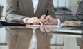 Business people or lawyers signing contract at meeting. Close-up of human hands at work Royalty Free Stock Photo