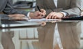 Business people or lawyers signing contract at meeting. Close-up of human hands at work Royalty Free Stock Photo