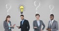 Business people with light bulb and question marks Royalty Free Stock Photo