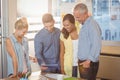 Business people looking at digital tablet in meeting room Royalty Free Stock Photo