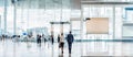 Business people with luggage standing in line at the airport and waiting their turn to go to the check-in counter or boarding gate Royalty Free Stock Photo