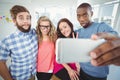 Business people making face while taking selfie Royalty Free Stock Photo