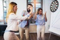 People making team training exercise during team building seminar, play darts. Indoor team building activities Royalty Free Stock Photo