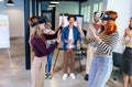 Business people making team training exercise during team building seminar using VR glasses Royalty Free Stock Photo