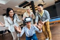 Business people making team training exercise during team building seminar using VR glasses Royalty Free Stock Photo