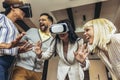 Business people making team training exercise during team building seminar using VR glasses Royalty Free Stock Photo