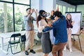 Business people making team training exercise during team building seminar using VR glasses Royalty Free Stock Photo