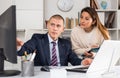 Business people man and woman discussing paperwork Royalty Free Stock Photo