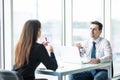 Business people man and woman Having Meeting at Table In Modern Office against panoramic windows Royalty Free Stock Photo