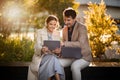 Business people mature man and woman using gadgets at park Royalty Free Stock Photo