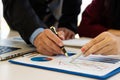 Business people meet with design ideas business planning Picture of two young businessmen holding pens and graph papers at a meeti Royalty Free Stock Photo