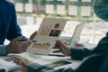 Business people meet with design ideas business planning Picture of two young businessmen holding pens and graph papers at a meeti Royalty Free Stock Photo