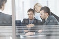 Business people meeting in boardroom behind glass Royalty Free Stock Photo