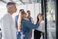 Business people meeting at office and use post it notes to share idea. Brainstorming concept. Sticky note on glass wall Royalty Free Stock Photo