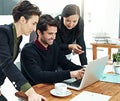 Business people, meeting and planning with teamwork, laptop and brainstorming for project launch. Support, communication Royalty Free Stock Photo