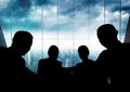 Business people at a meeting silhouettes against building Royalty Free Stock Photo