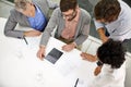 Business people, meeting and tablet screen above in teamwork for planning, discussion or collaboration at office. Top Royalty Free Stock Photo