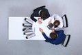 Business people at meeting, view from above. Bookkeeper or financial inspector making report, calculating or checki